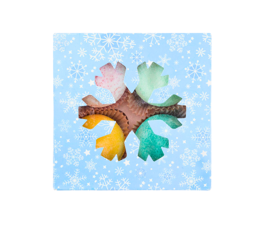 Colorful bath bomb set in a blue box with snowflake patterns