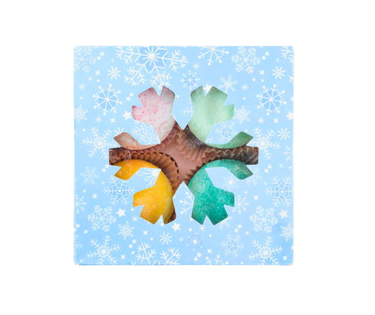 Colorful bath bomb set in a blue box with snowflake patterns